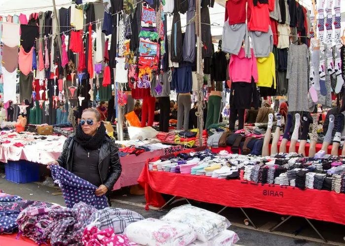Outdoor neighborhood bazaar with shoppers in Istanbul