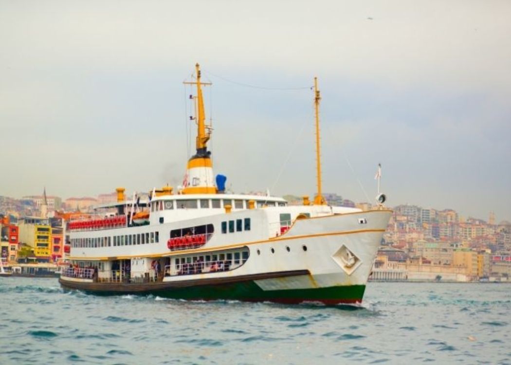 Conventional ferry crossing Istanbul waterways near central city piers