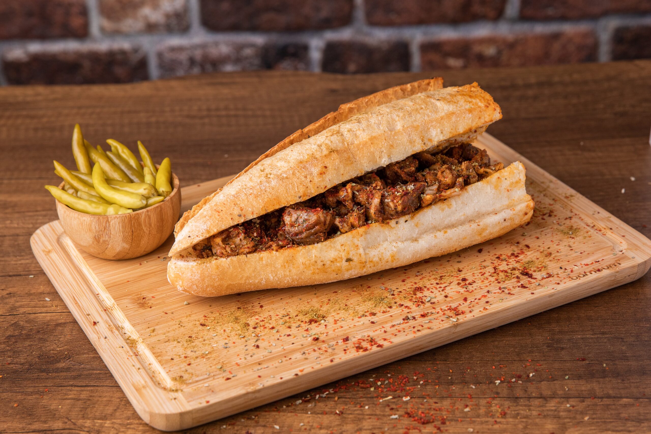 Grilled kokoreç sandwich served Istanbul street food style